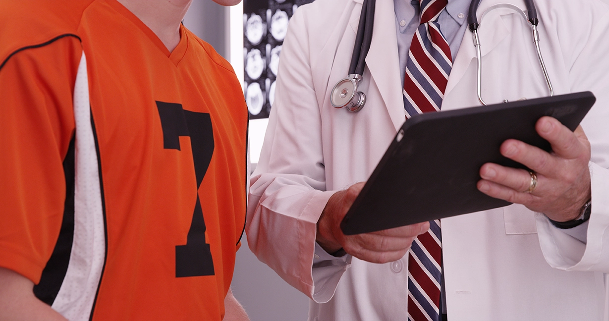 An athlete receiving a consultation from a cardiologist