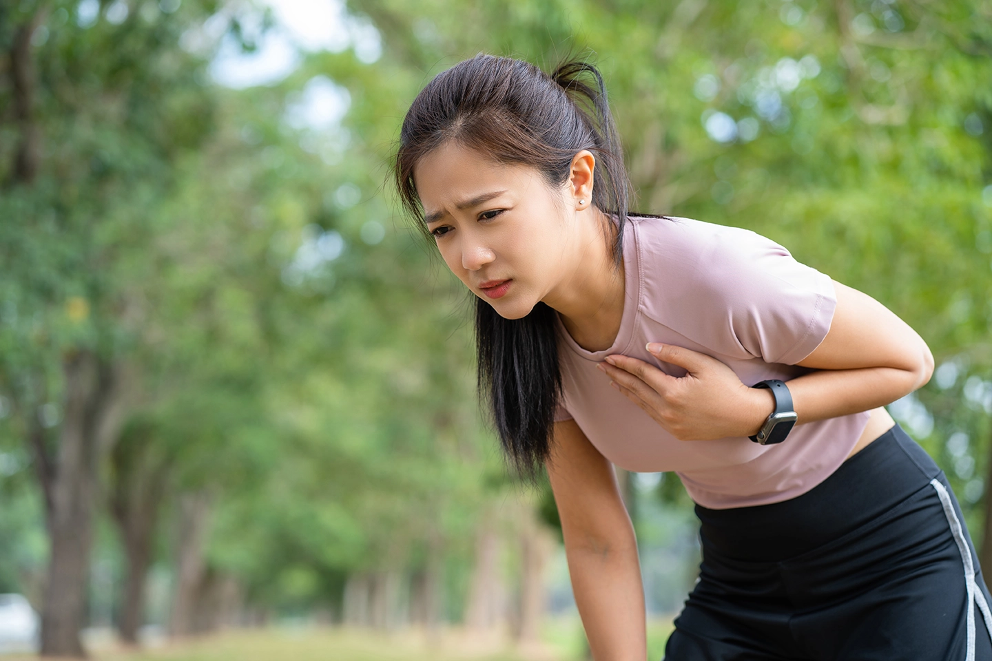 A girl experiencing chest discomfort during exercise
