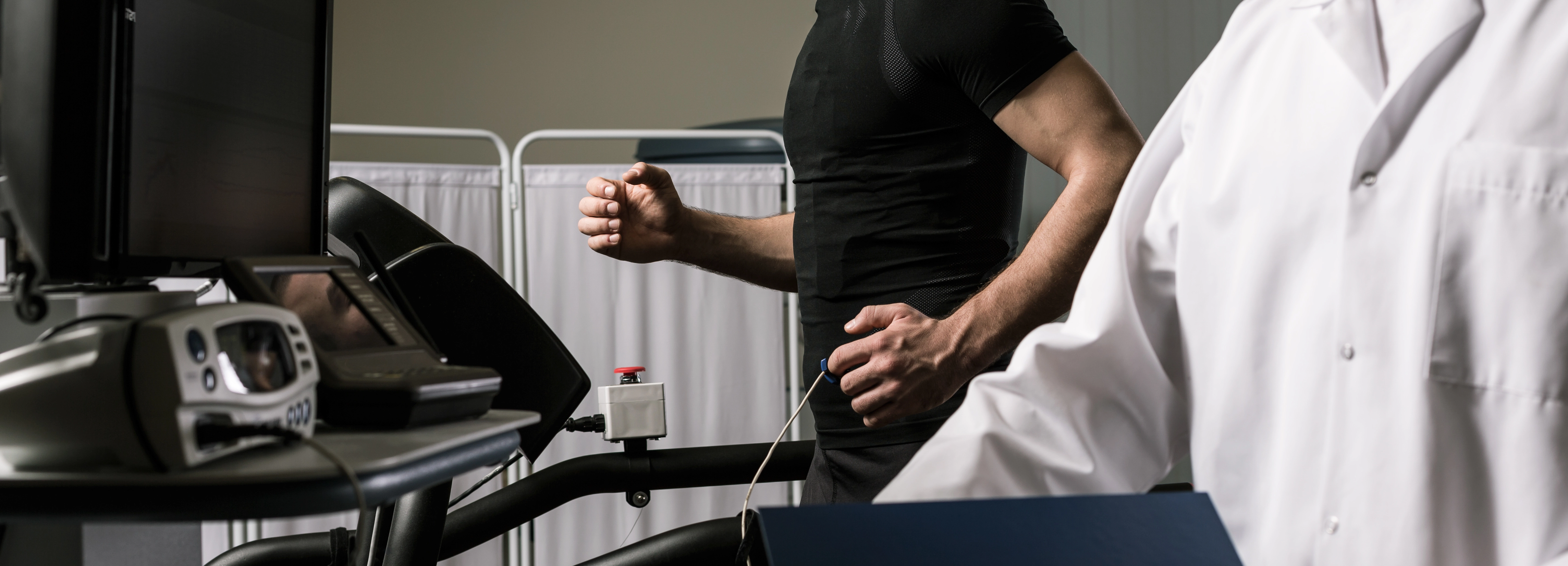 A doctor carrying out a sports cardiology assessment at a clinic