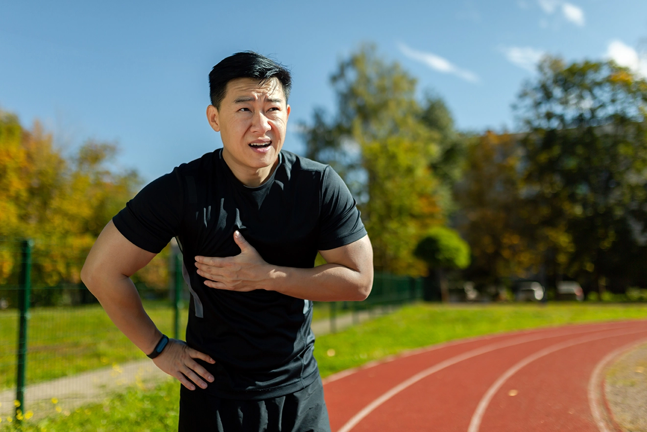 A man experiencing severe chest discomfort after exercise