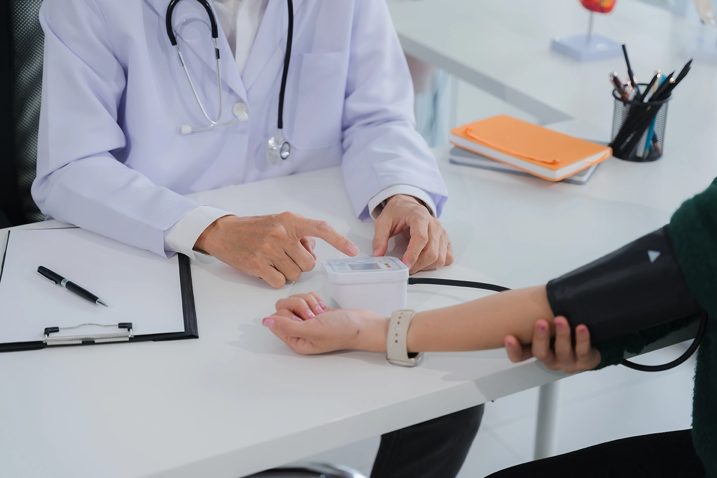 A doctor measuring a patient's blood pressure